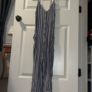 Gray jumpsuit with white and black stripes